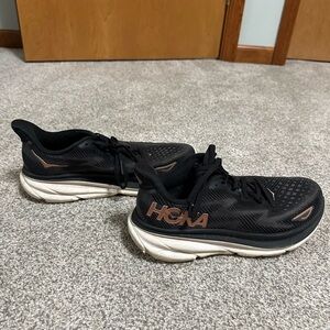 HOKA women’s Black Running Shoes with Brown Accents